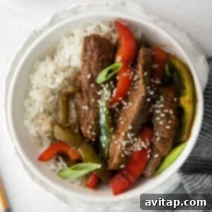 Pepper steak sprinkled with sesame seeds.