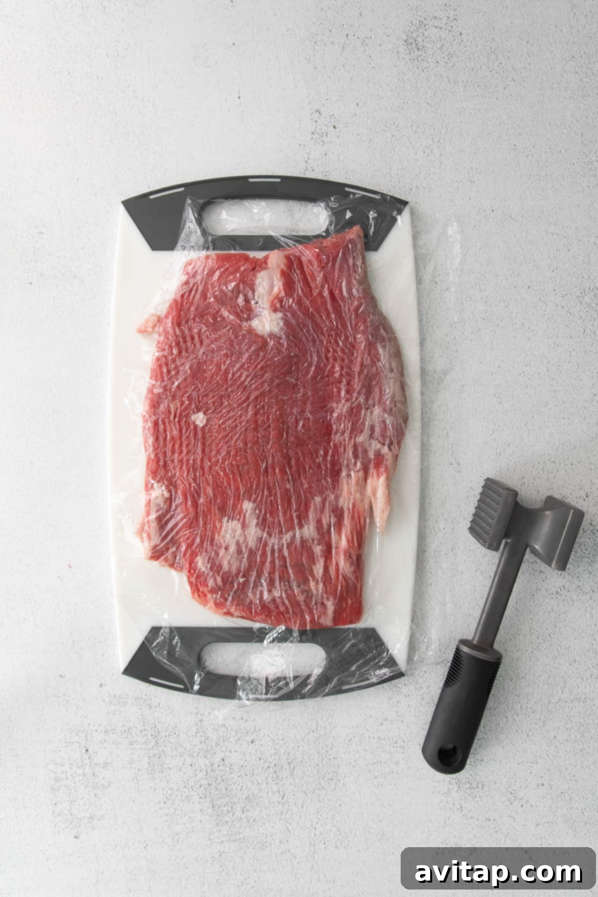 Flank steak with a meat tenderizer.