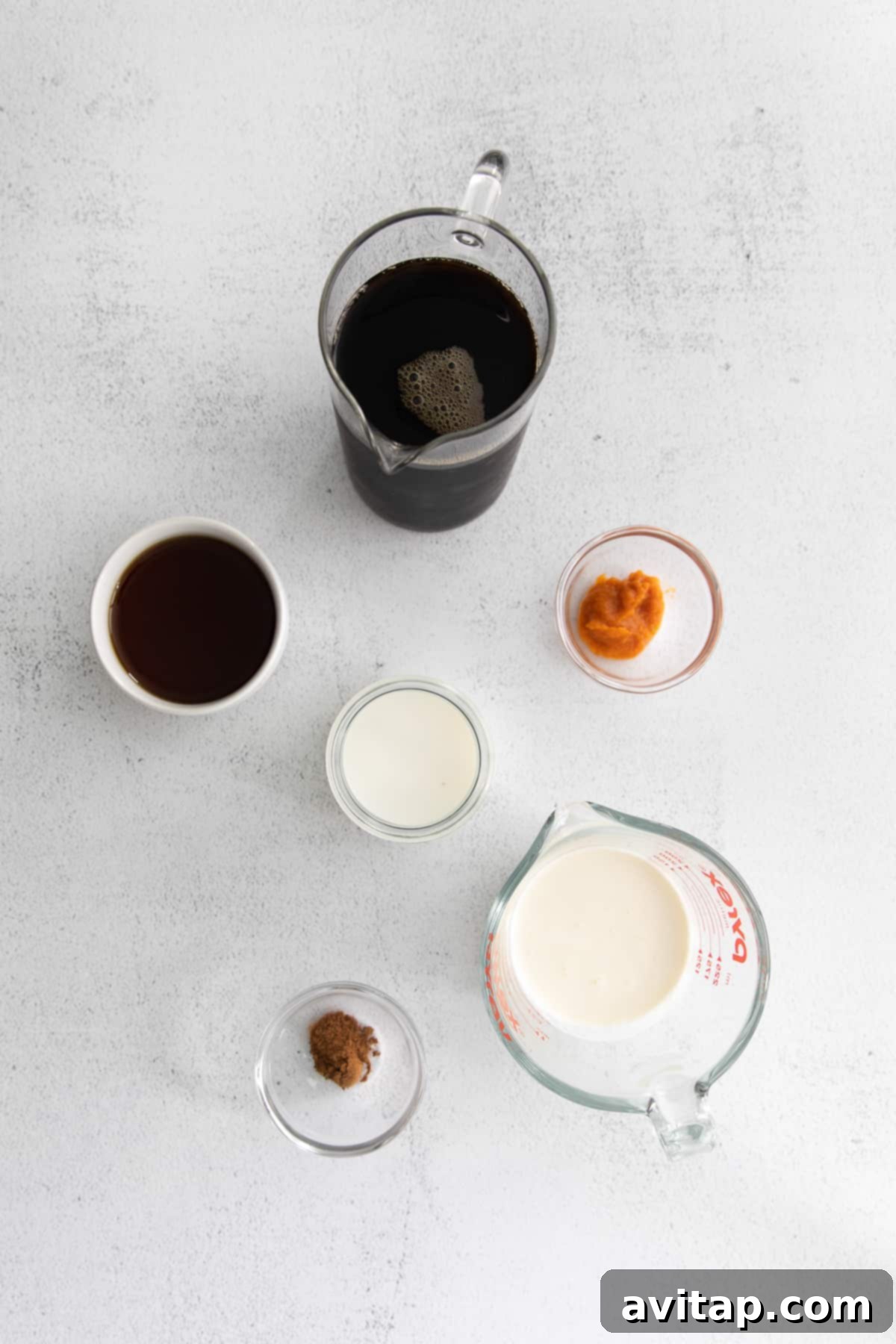Velvet Pumpkin Cold Brew 3 Individual ingredients for Pumpkin Cream Cold Brew displayed in small, elegant containers.
