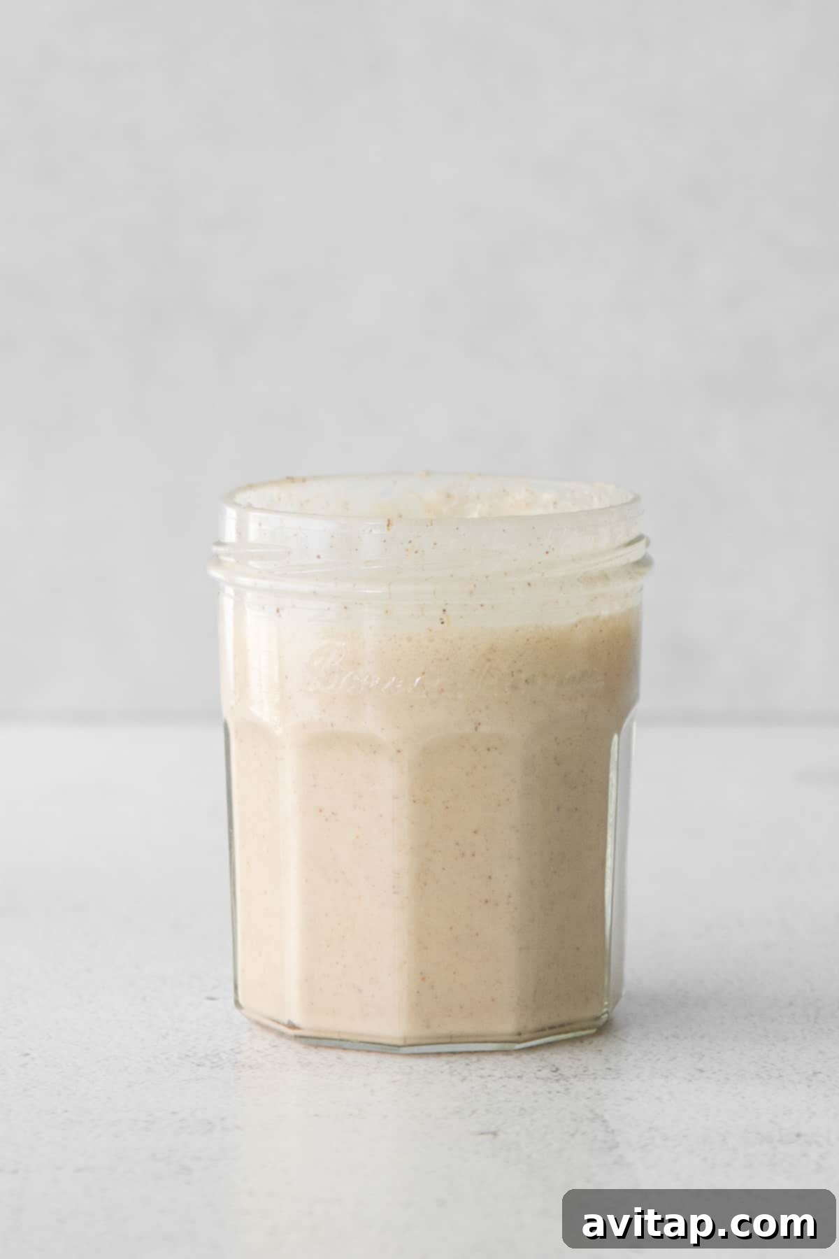 Velvet Pumpkin Cold Brew 4 Smooth, orange-hued pumpkin cream in a glass jar, ready to be frothed or poured.