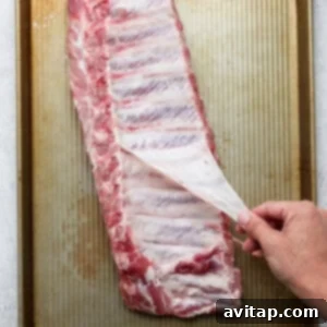 Fall-Off-The-Bone Oven Ribs 5 Removing the membrane from a rack of ribs.
