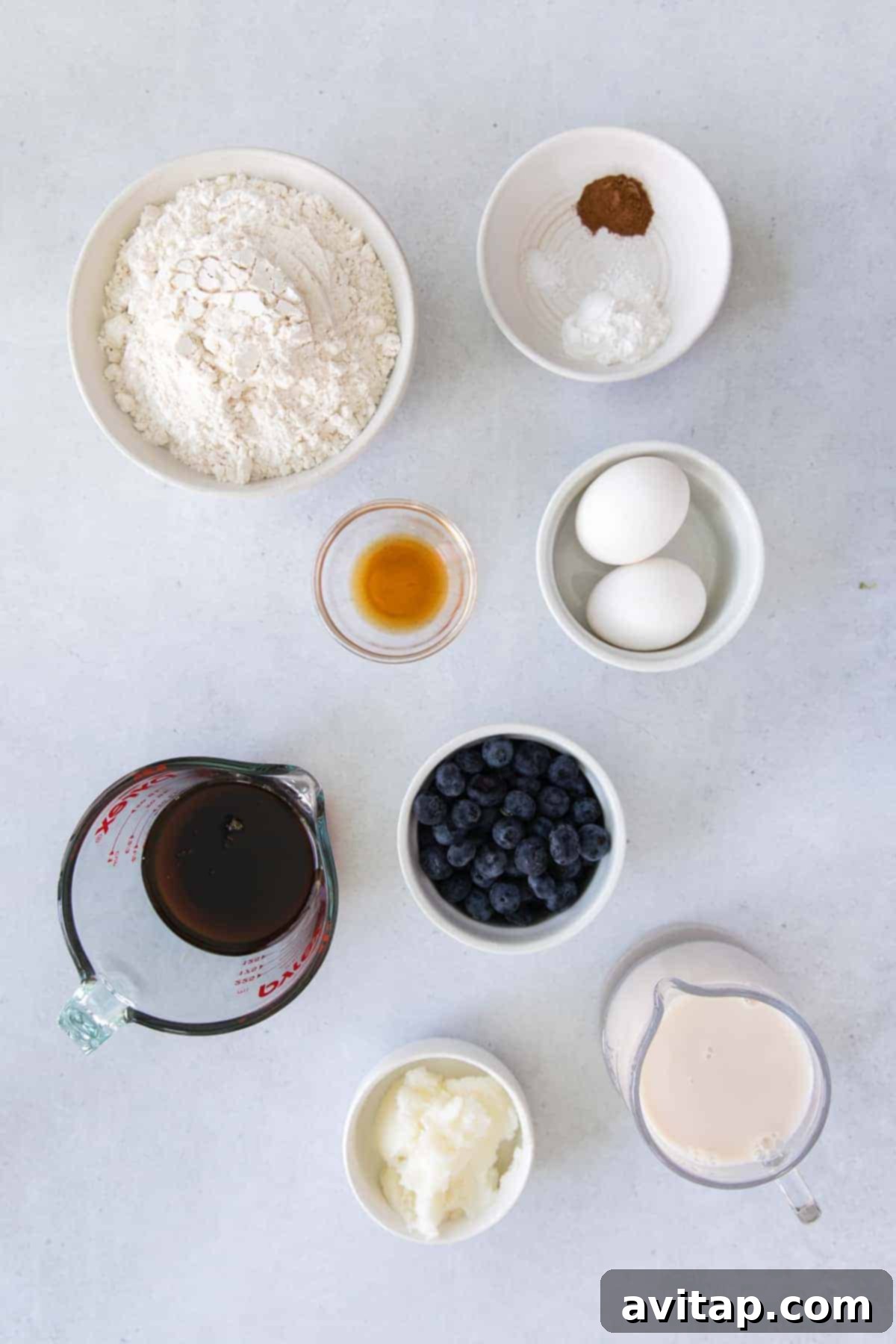 A collection of fresh ingredients laid out on a kitchen counter, ready for baking.