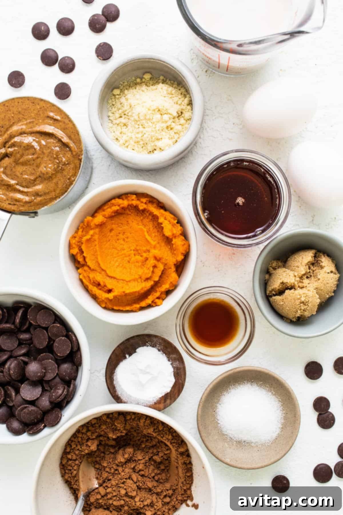 A kitchen counter adorned with an array of bowls, each containing a different wholesome ingredient for baking.