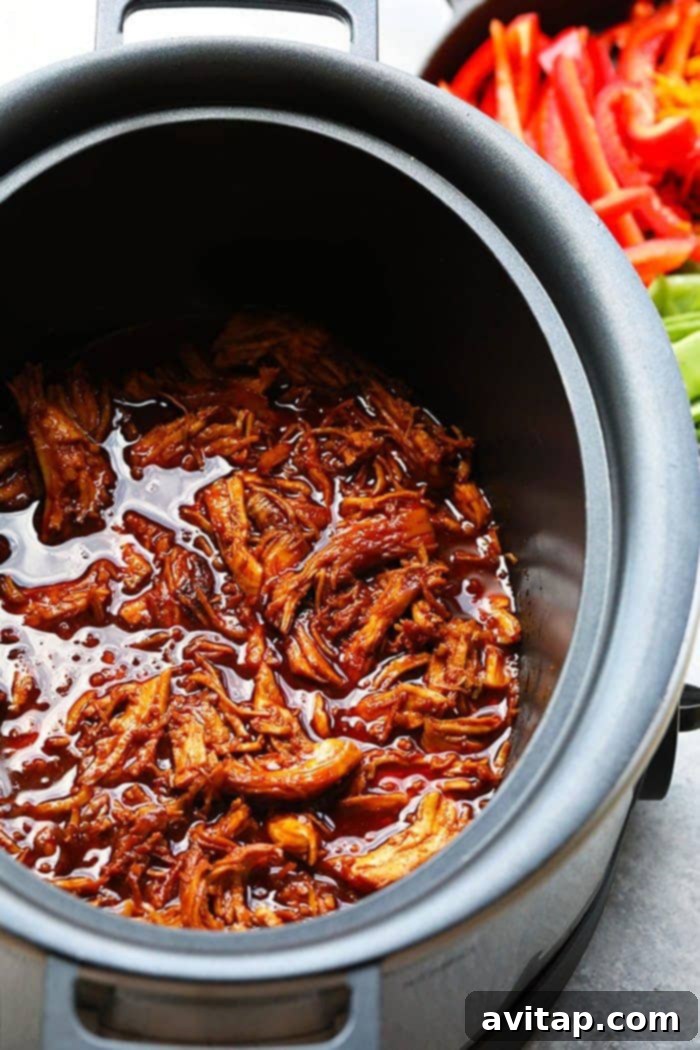 Honey Sriracha Chicken in Slow Cooker, ready to be served over rice