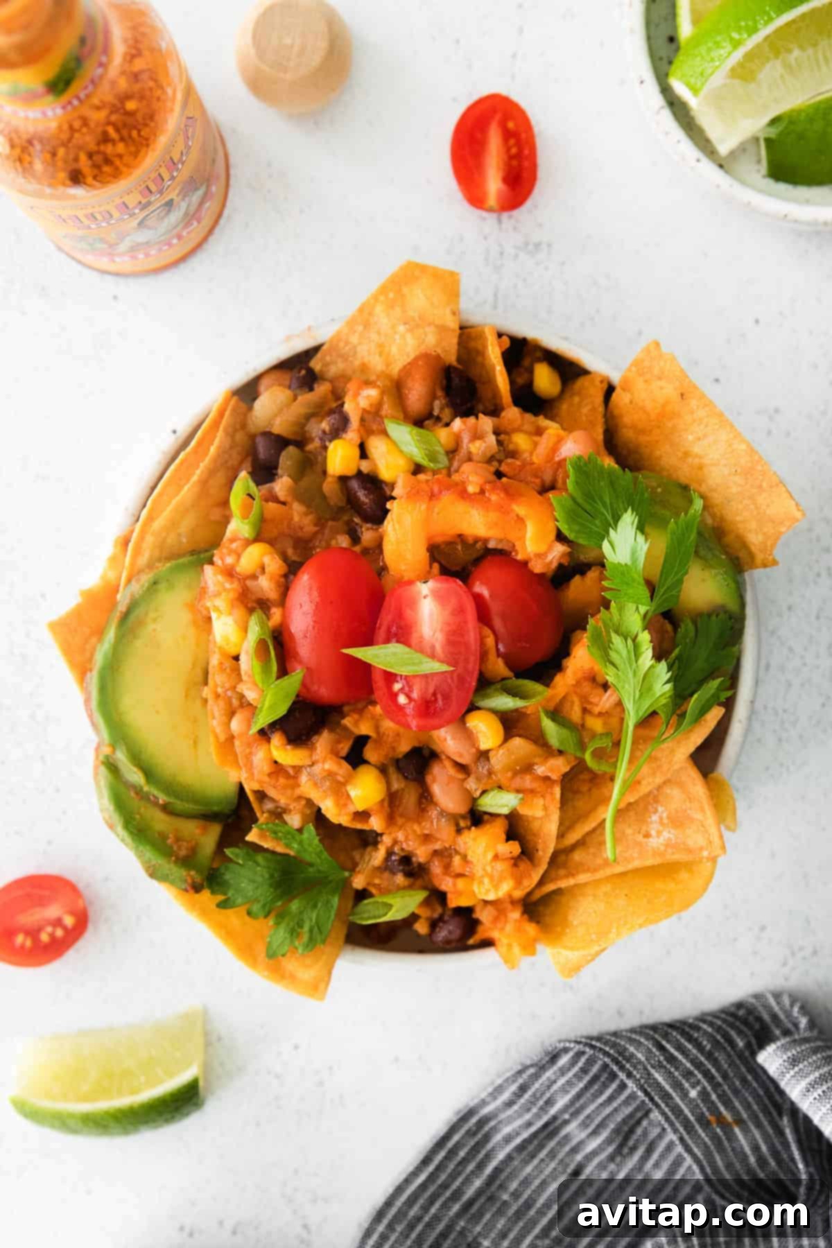 A vibrant bowl of cauliflower taco skillet, garnished with fresh cilantro and lime, ready for serving.