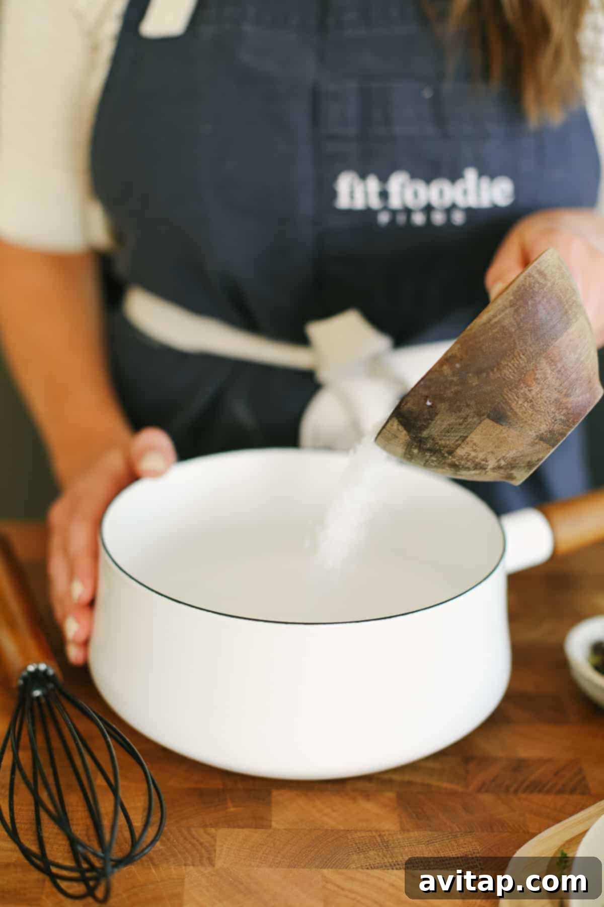 The Ultimate Smoked Turkey Brine 7 Pouring salt into a small saucepan with water.