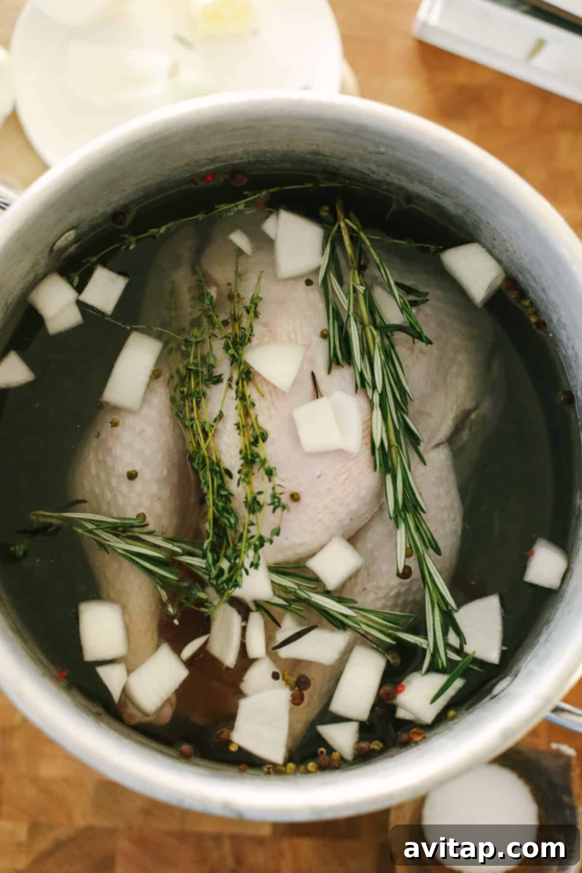 The Ultimate Smoked Turkey Brine 10 A turkey in a large pot.