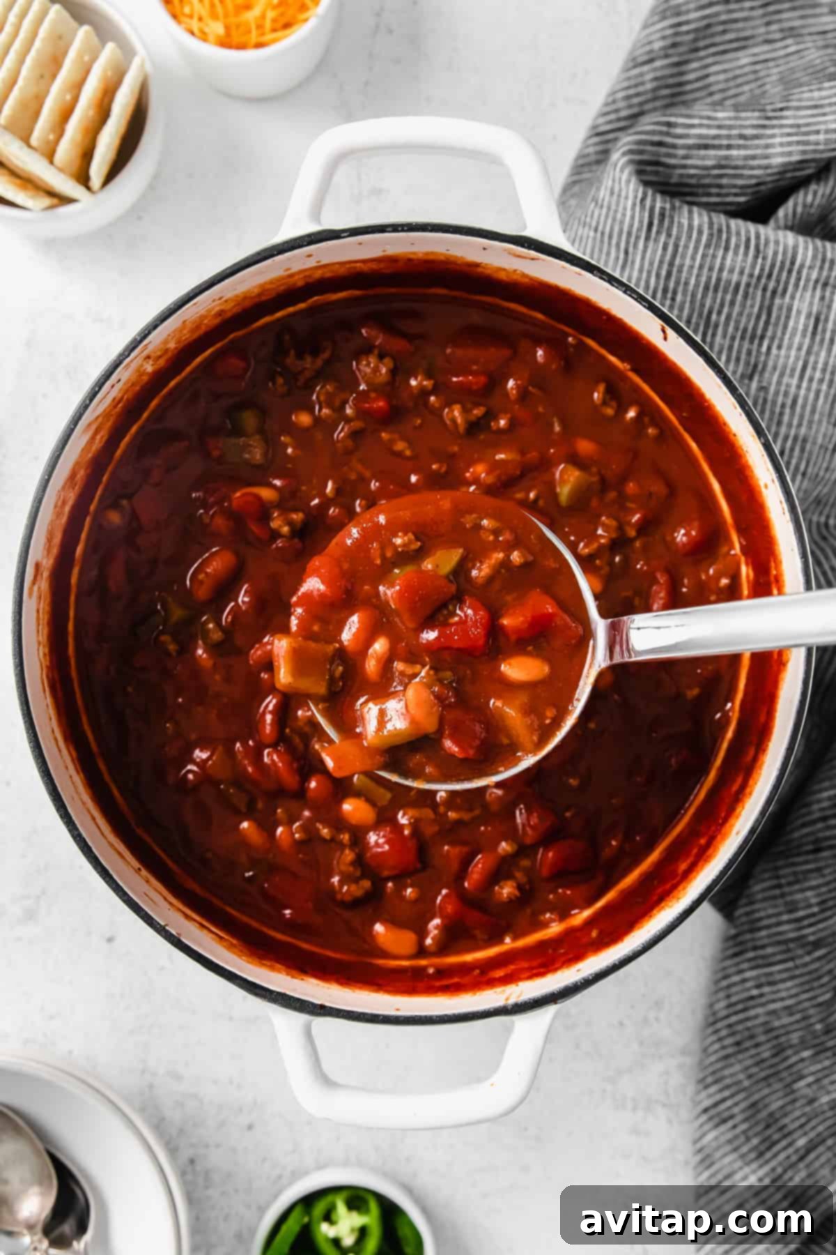 Close-up of a pot of rich, homemade chili, ready to be served.