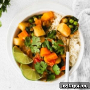 A close-up of a bowl of Instant Pot Pumpkin Curry, showing its rich texture and colorful ingredients.