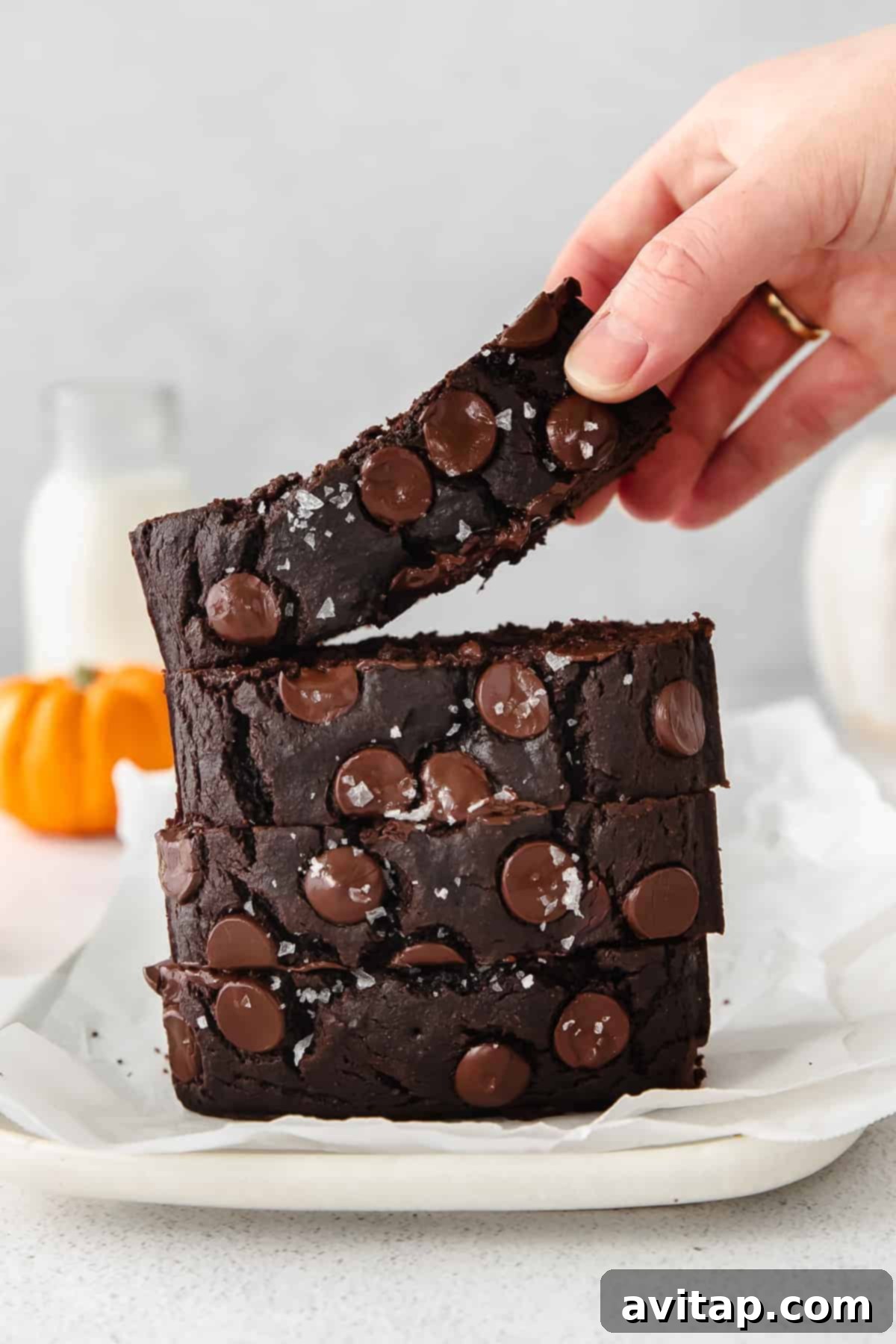 A stack of delicious chocolate pumpkin bread, perfectly baked and ready for fall.