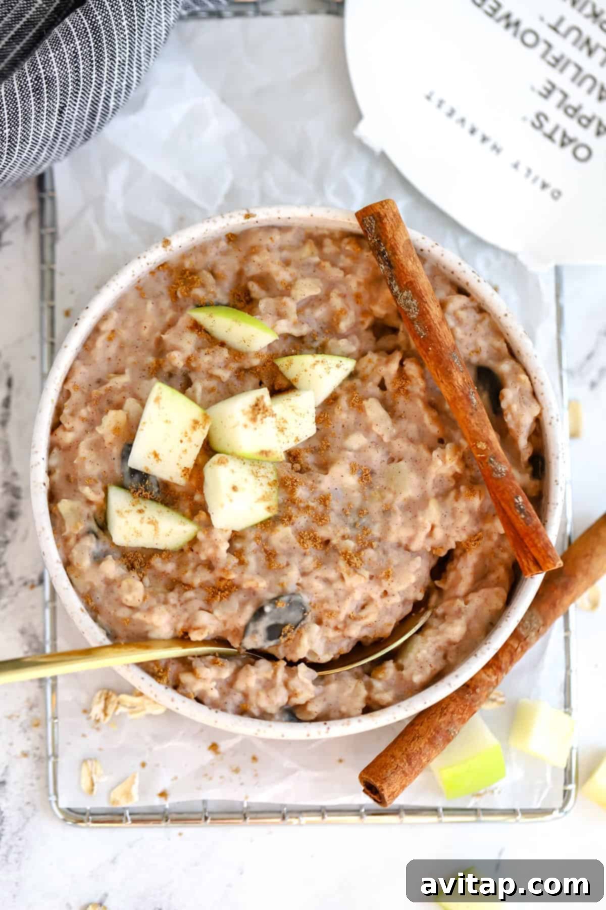 finished Daily Harvest oat bowl topped with sliced apples and cinnamon