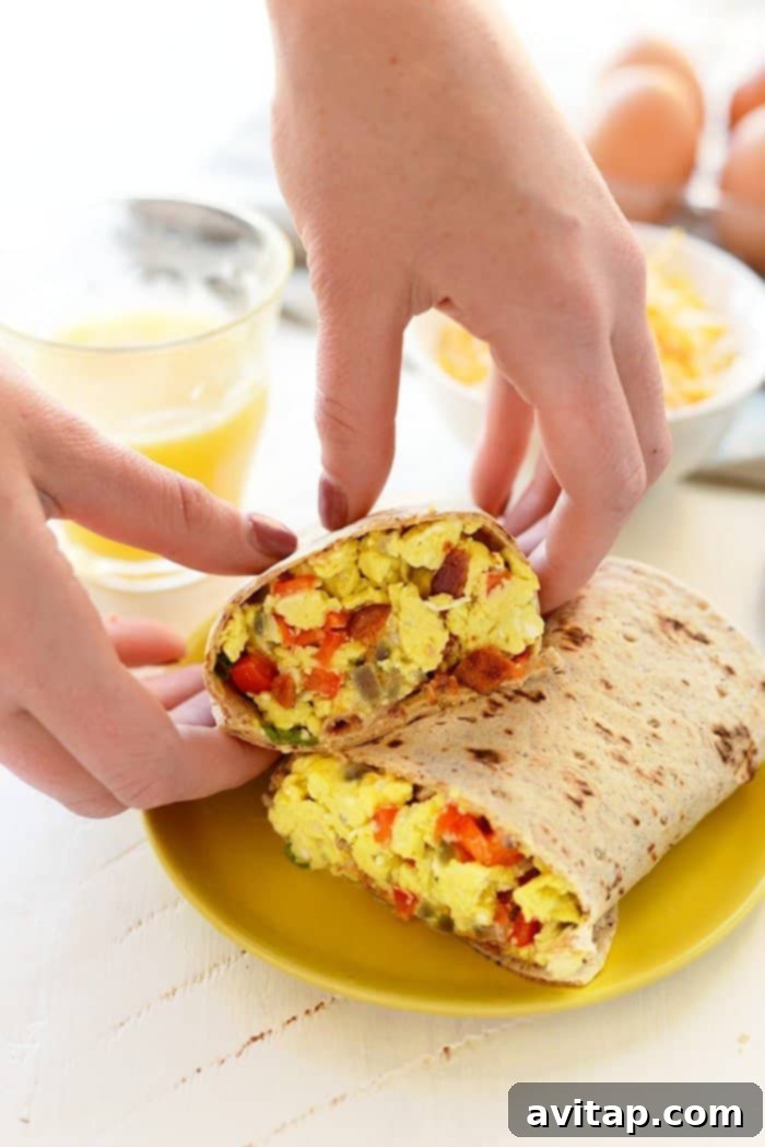 A plate featuring a freshly reheated breakfast burrito, showcasing its appetizing appeal and readiness to be enjoyed.