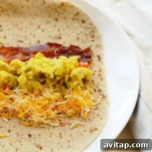 a breakfast burrito with eggs and cheese.