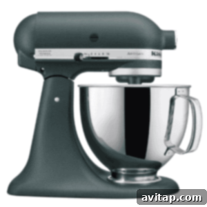 Ultimate Flourless Peanut Butter Blossoms 3 A dark green KitchenAid stand mixer, essential for any baker.