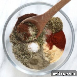 A small bowl containing a homemade blend of flavorful turkey seasoning.