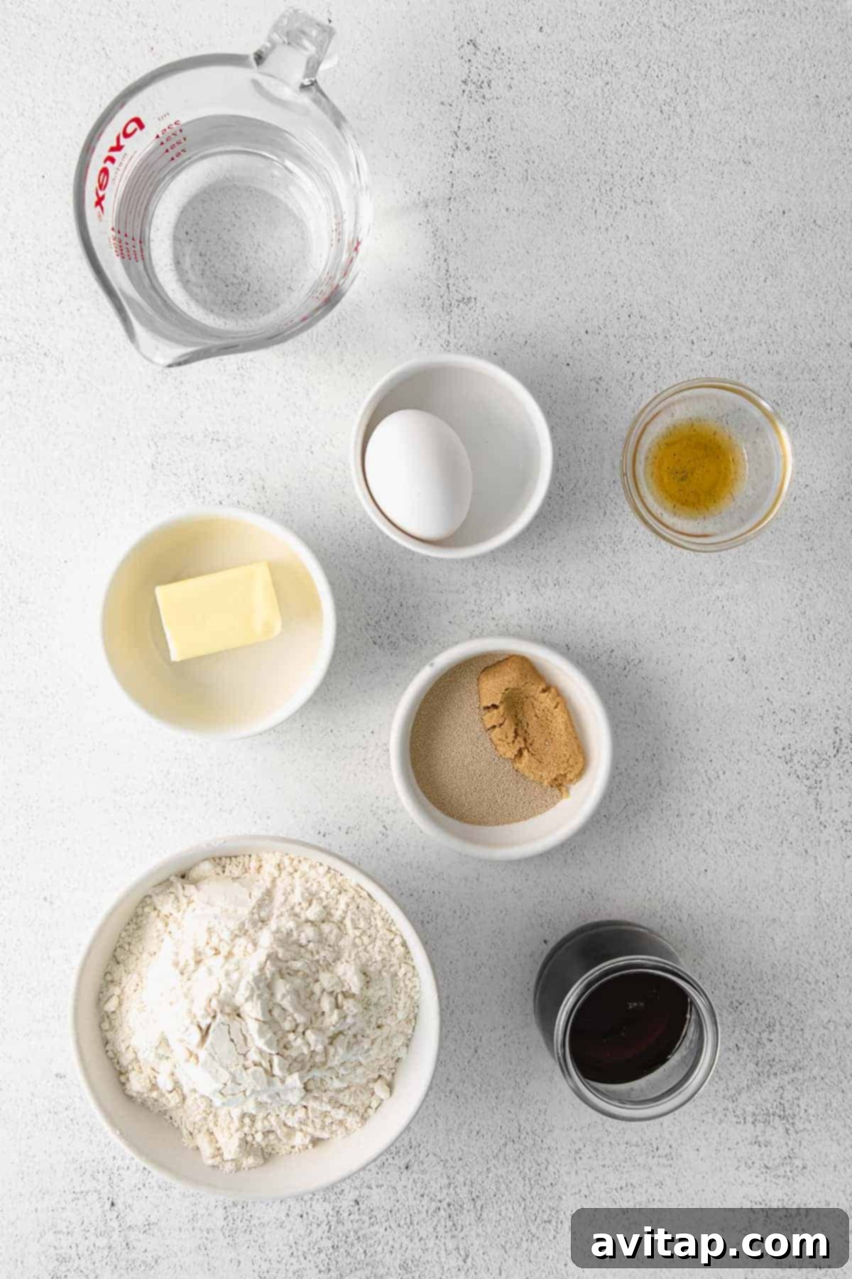 ingredients for maple cinnamon rolls laid out in small bowls