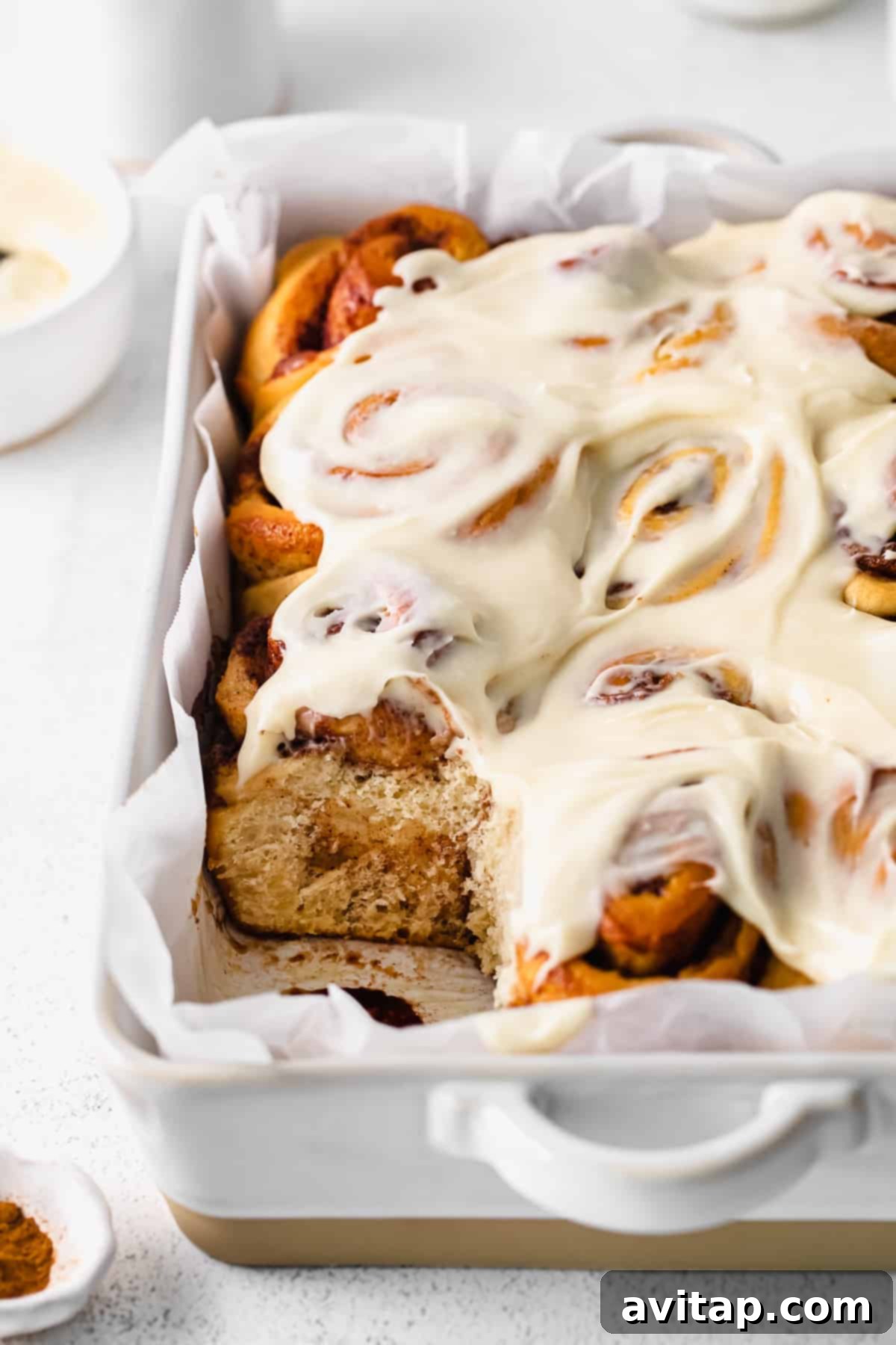 maple cinnamon rolls topped with creamy cream cheese frosting
