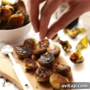Roasted Brussels sprouts with olive oil, ready for baking to achieve optimal crispiness and flavor.