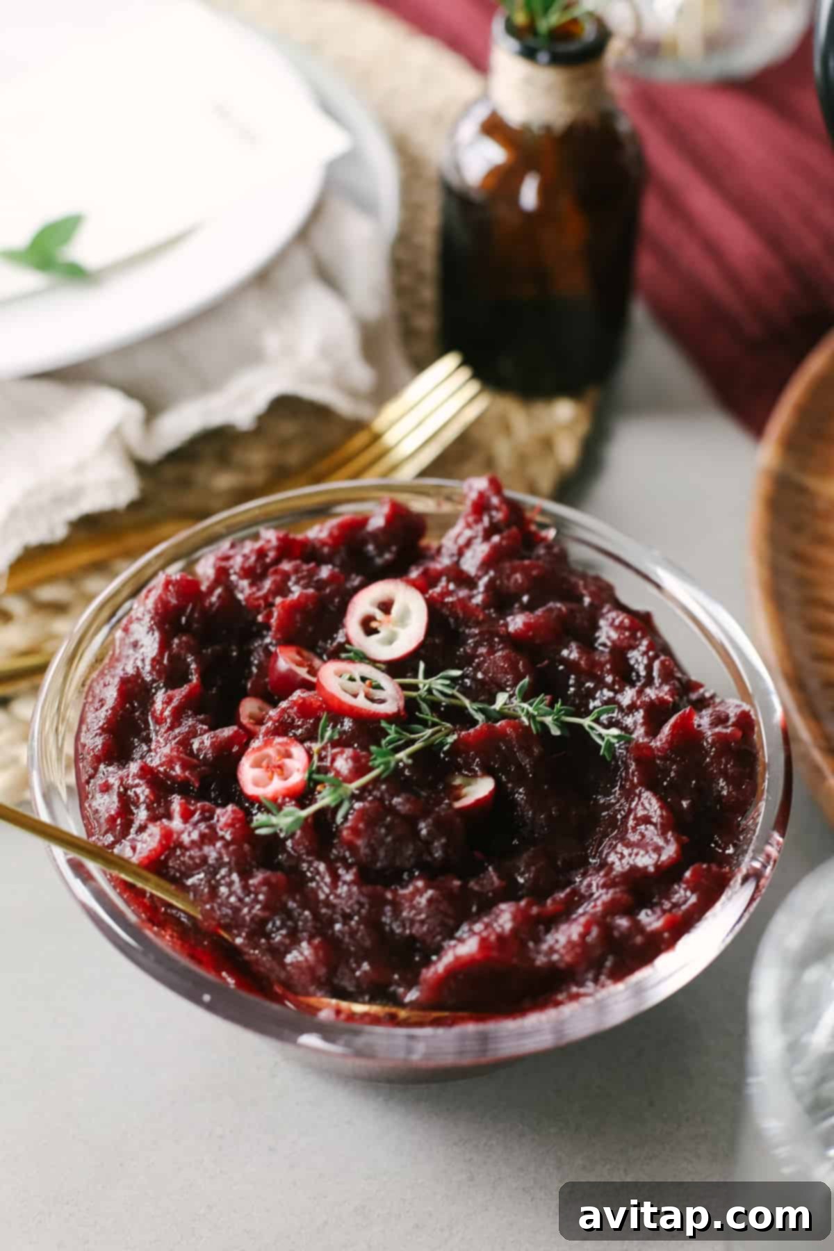 Homemade Lemon Ginger Cranberry Sauce A glistening bowl of homemade lemon ginger cranberry sauce, vibrant and ready to add a burst of flavor to any Thanksgiving plate.