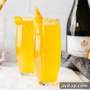 Simple mimosa recipe, showing a single mimosa glass with a beautiful orange hue.