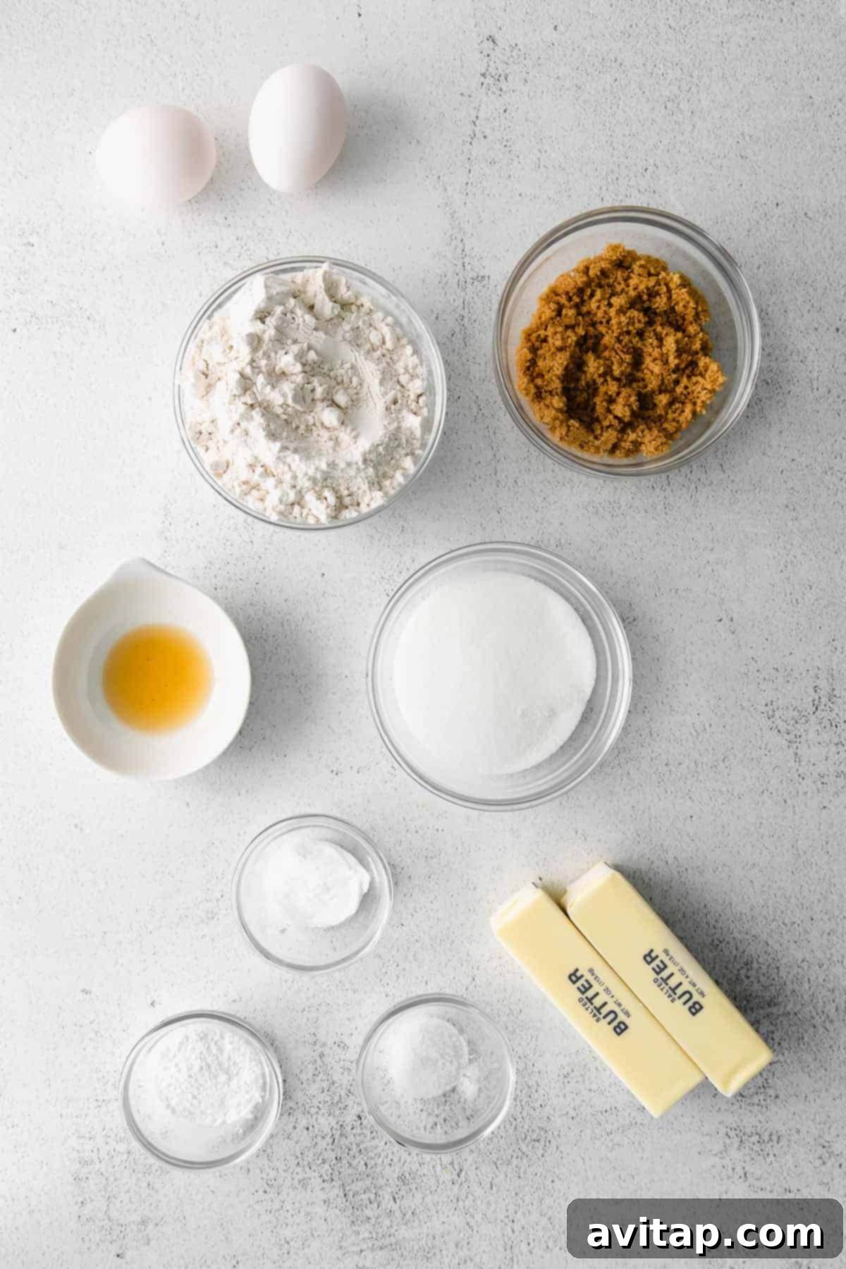 Snicker doodle ingredients laid out in small bowls, ready for baking.