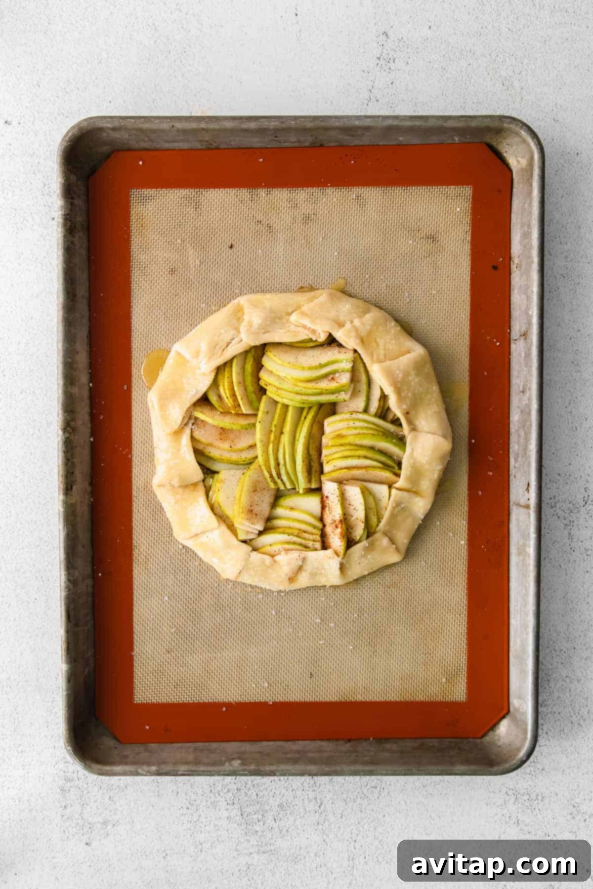 Rustic Honey-Kissed Pear Tart 7 A freshly baked honey pear galette, drizzled with honey and ready to serve.