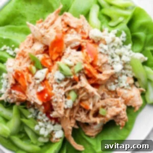 Healthy buffalo chicken served in crisp lettuce wraps, a great way to enjoy the classic flavor.