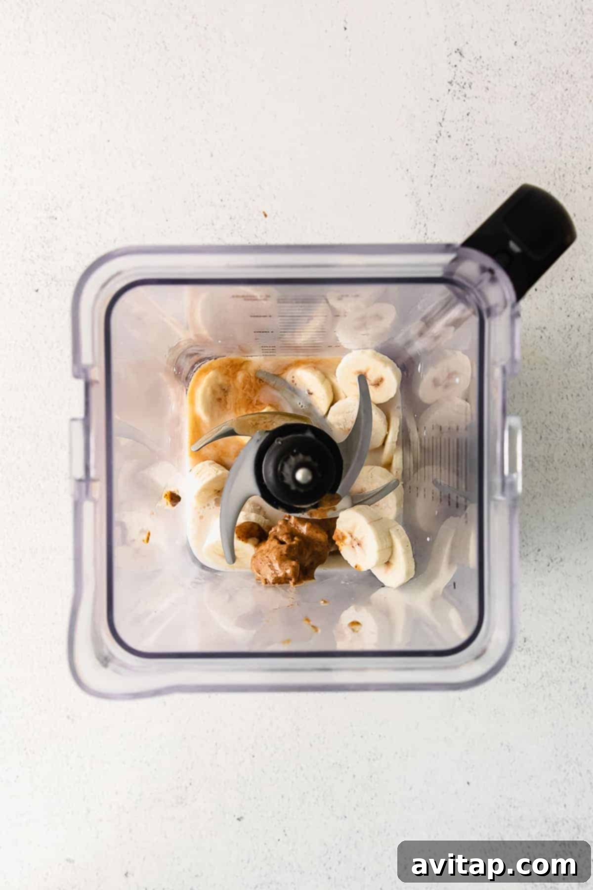 Decadent Chocolate Chip Cookie Dough Smoothie 5 All the vibrant ingredients for a cookie dough blizzard smoothie are perfectly loaded into a high-speed blender, ready to be transformed.