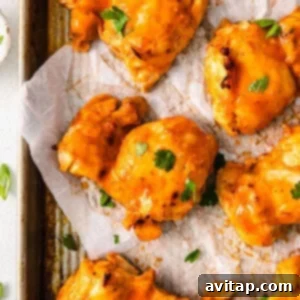 Buffalo chicken wings baked on a baking sheet