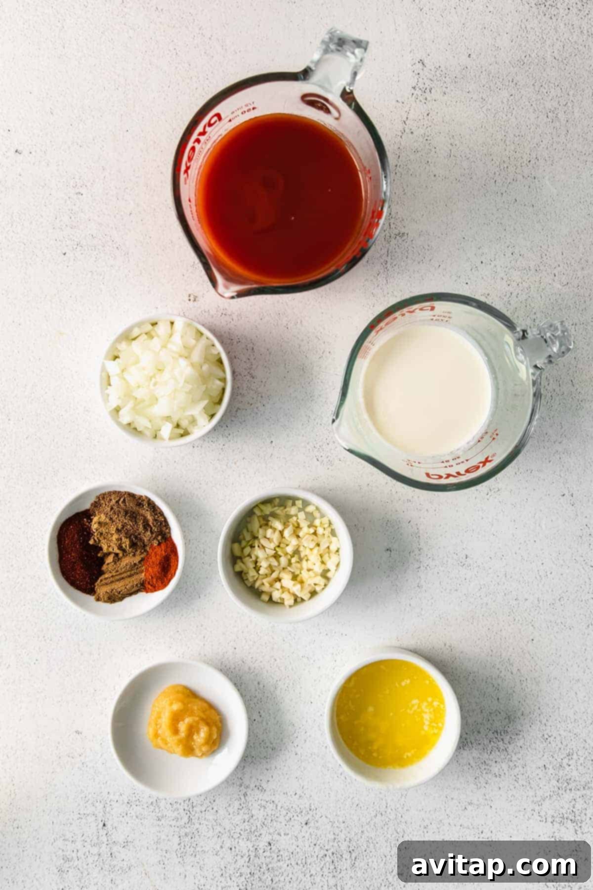 Irresistible Butter Chicken 4 Tomato sauce, garam masala, and other ingredients for butter chicken.