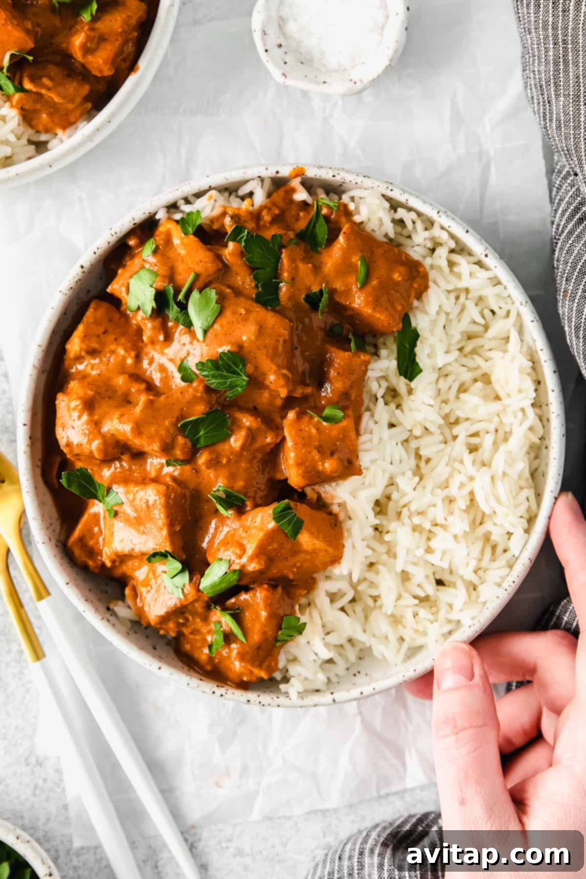 Irresistible Butter Chicken 7 Butter chicken served over rice.