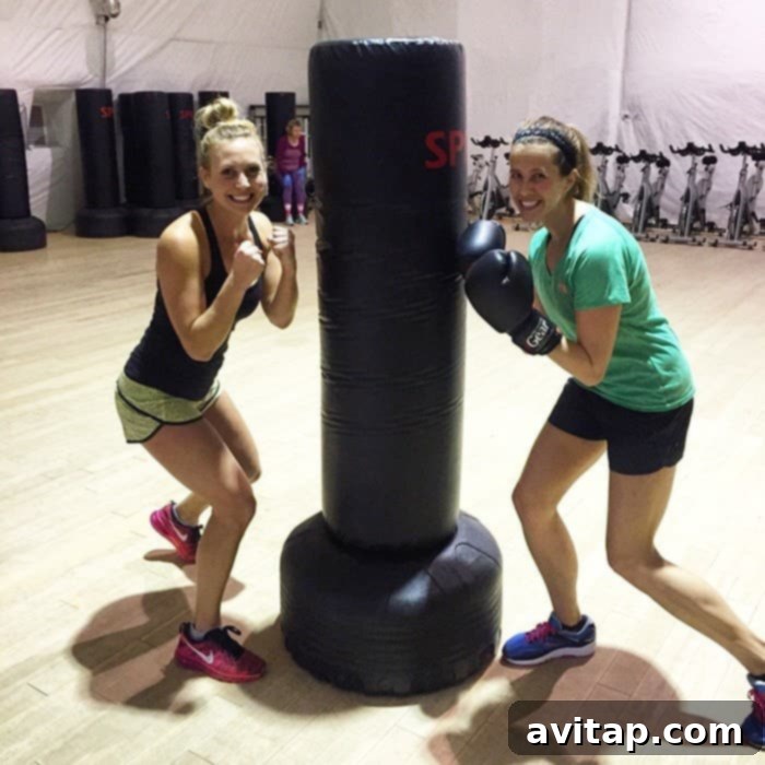 Participants enthusiastically engaging in a group fitness class at Wellfit Malibu, demonstrating the dynamic and energetic workout environment.