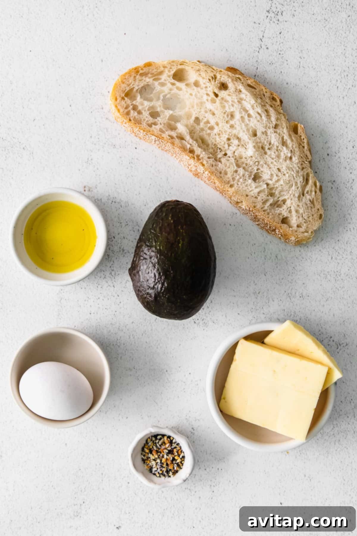 Fresh ingredients laid out for avocado toast recipes