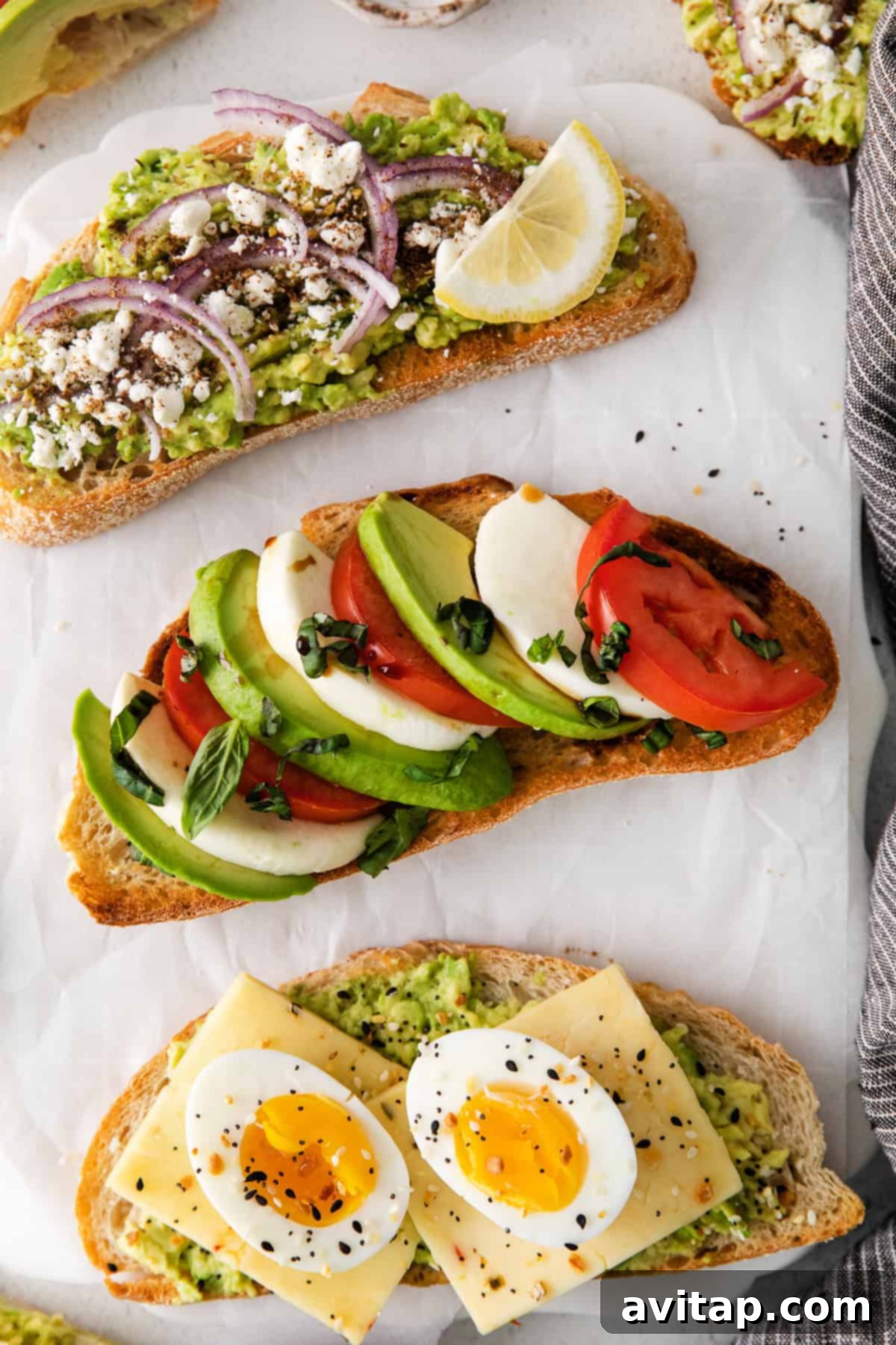 Avocado toast topped with fresh caprese ingredients