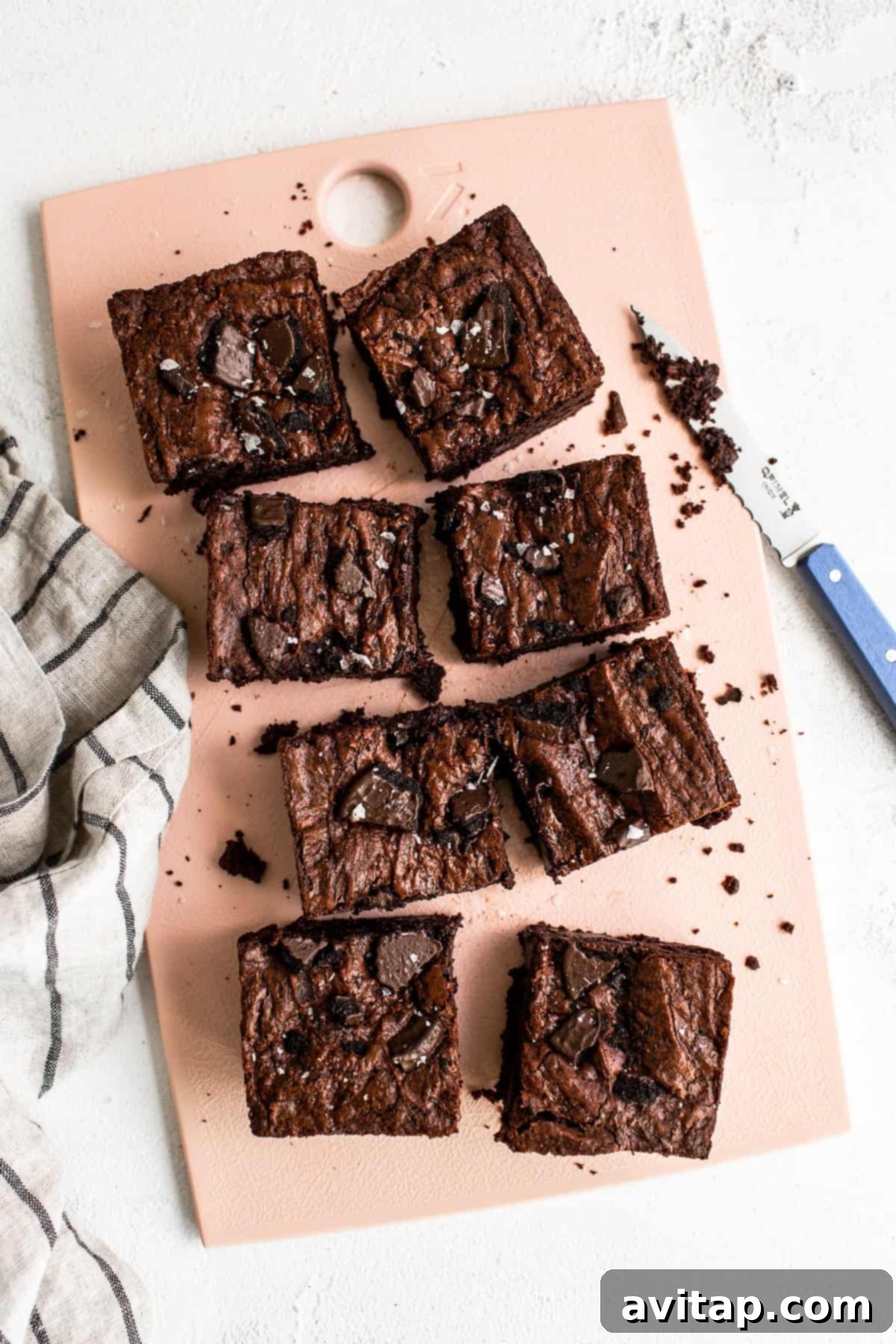 Fudgy Chocolate Mint Brownies with Thin Mint cookies on a cutting board