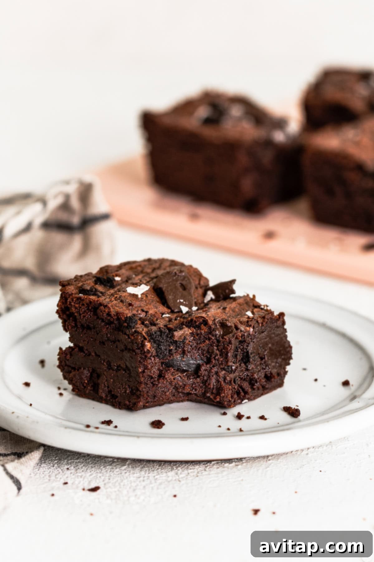 A single Thin Mint brownie on a plate, showcasing its rich texture