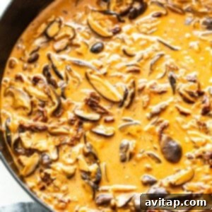 Chicken mushroom pasta sauce in a pan with cream.