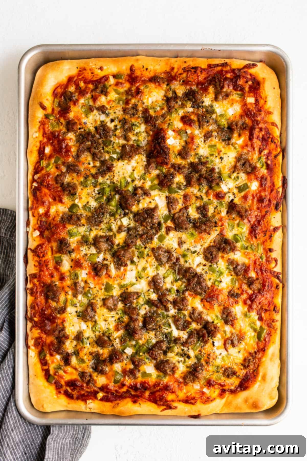 Freshly Baked Homemade Pizza A glorious homemade pizza, freshly baked with a golden crust, bubbling melted cheese, and perfectly cooked toppings, ready to be sliced.