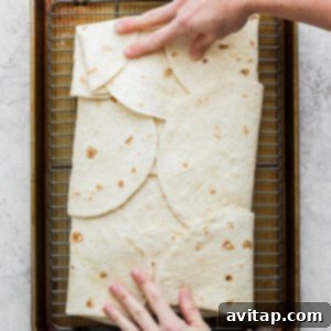 A second baking sheet placed on top of the quesadilla to weigh it down during baking, preventing curling and ensuring even crispiness.