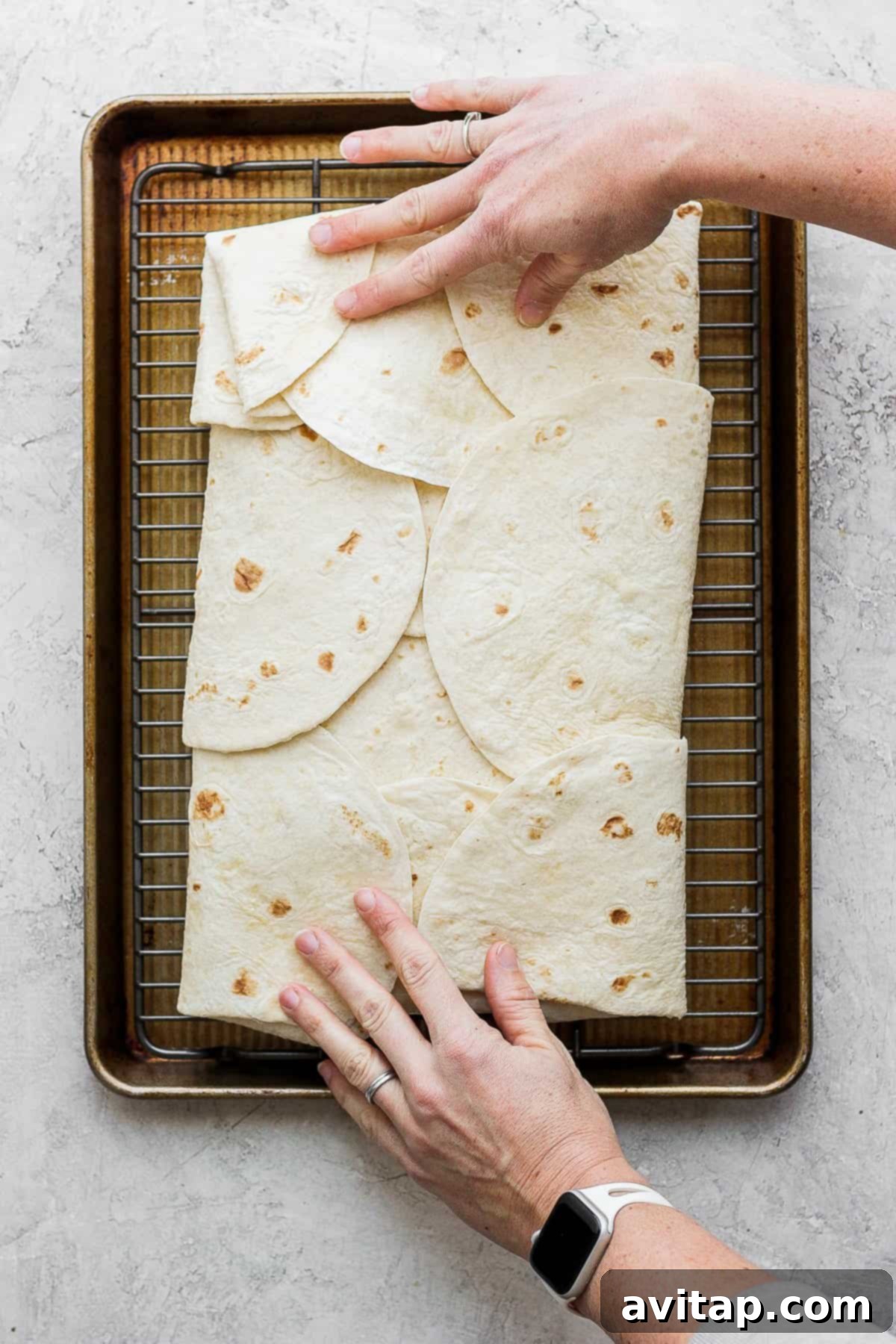 The fully assembled sheet pan quesadilla, neatly folded and ready for baking, showcasing a tight, secure wrap.