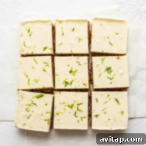 Perfectly sliced margarita pie bars on parchment paper, ready to be enjoyed.
