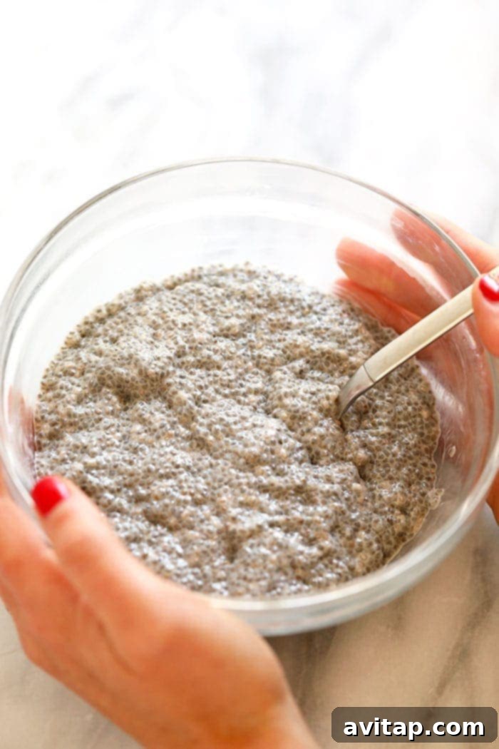chia seed pudding being stirred in a bowl