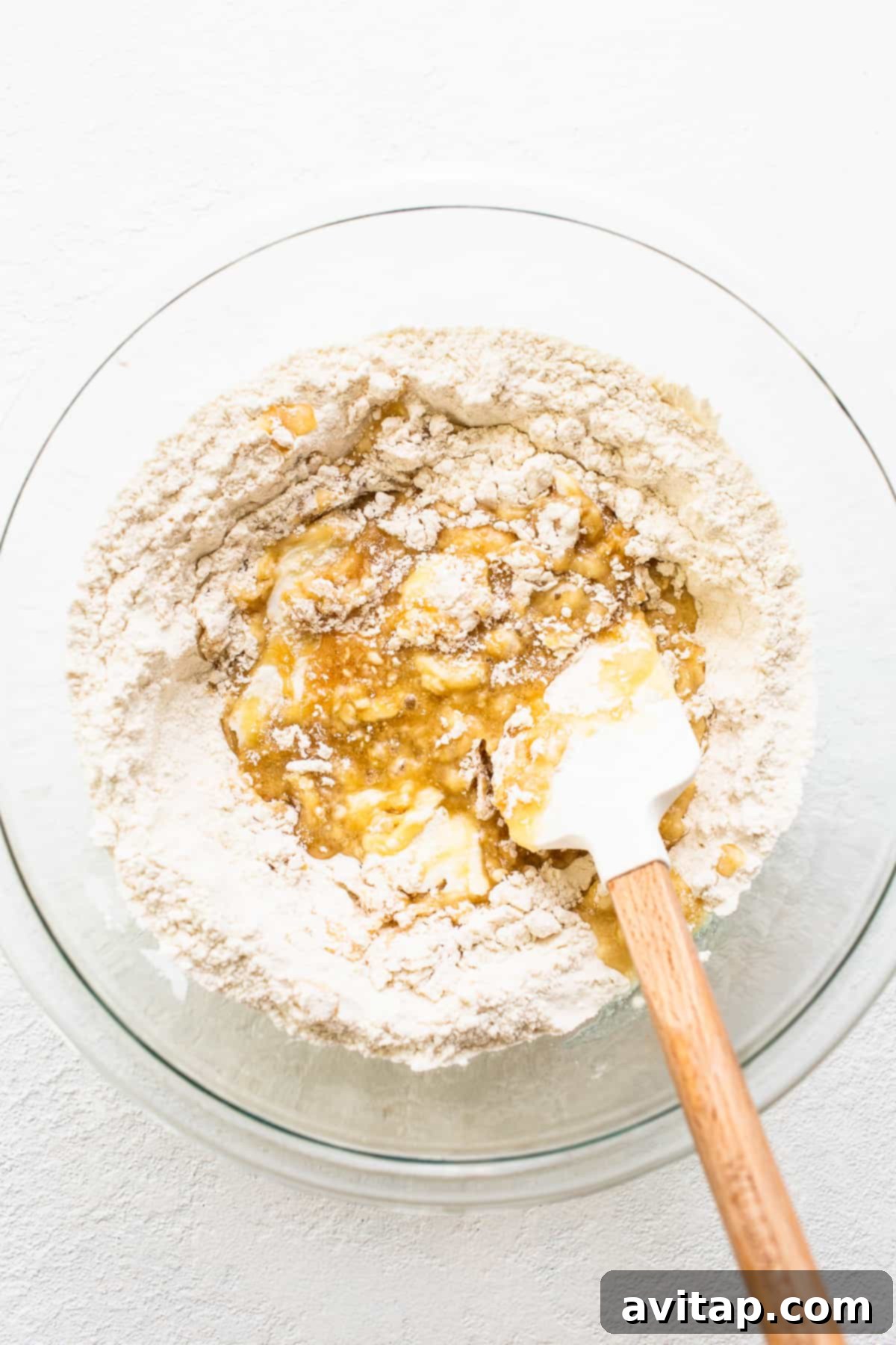 Mixing ingredients for the buttery shortbread crust in a large mixing bowl.