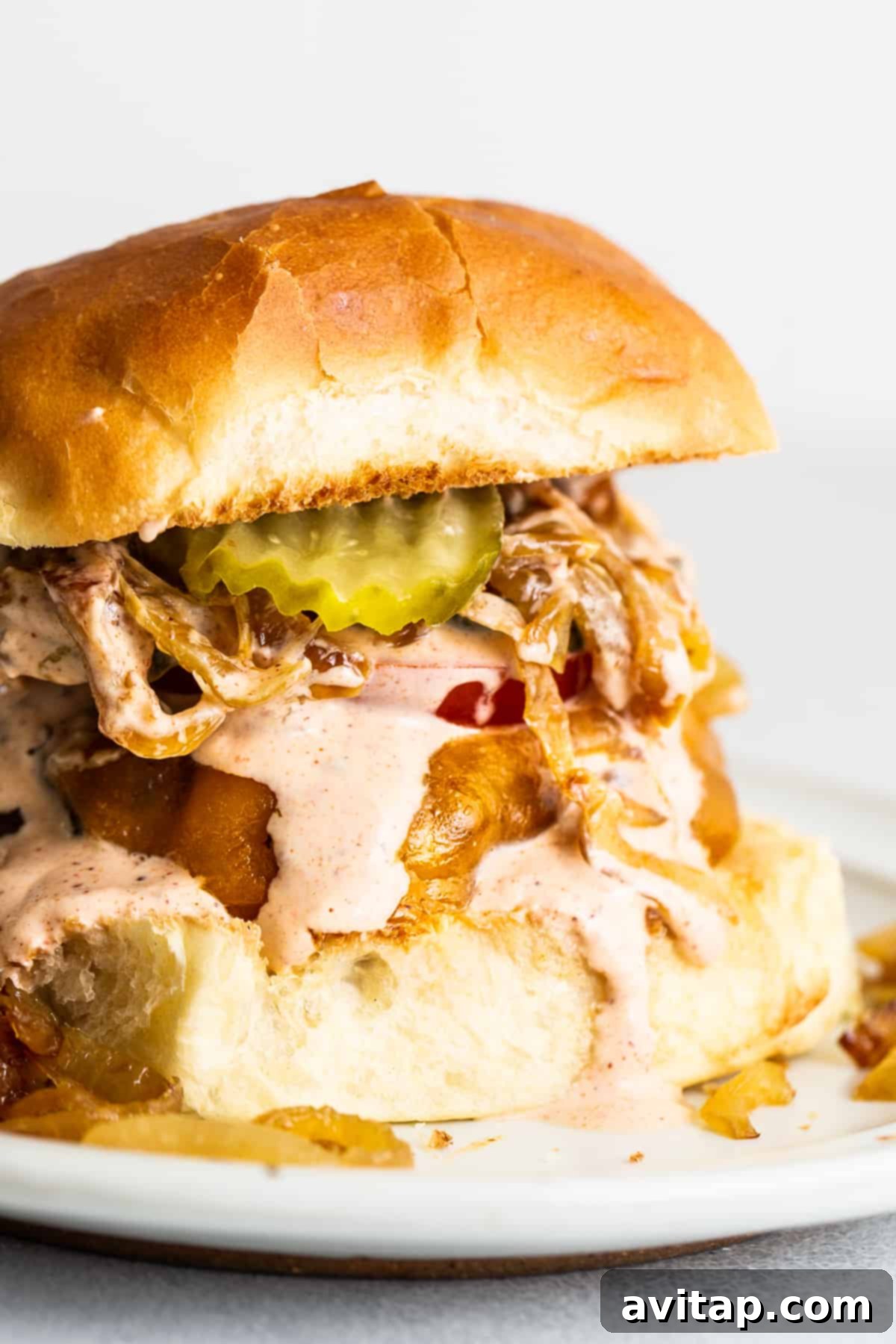 Burger topped with burger sauce and other toppings.