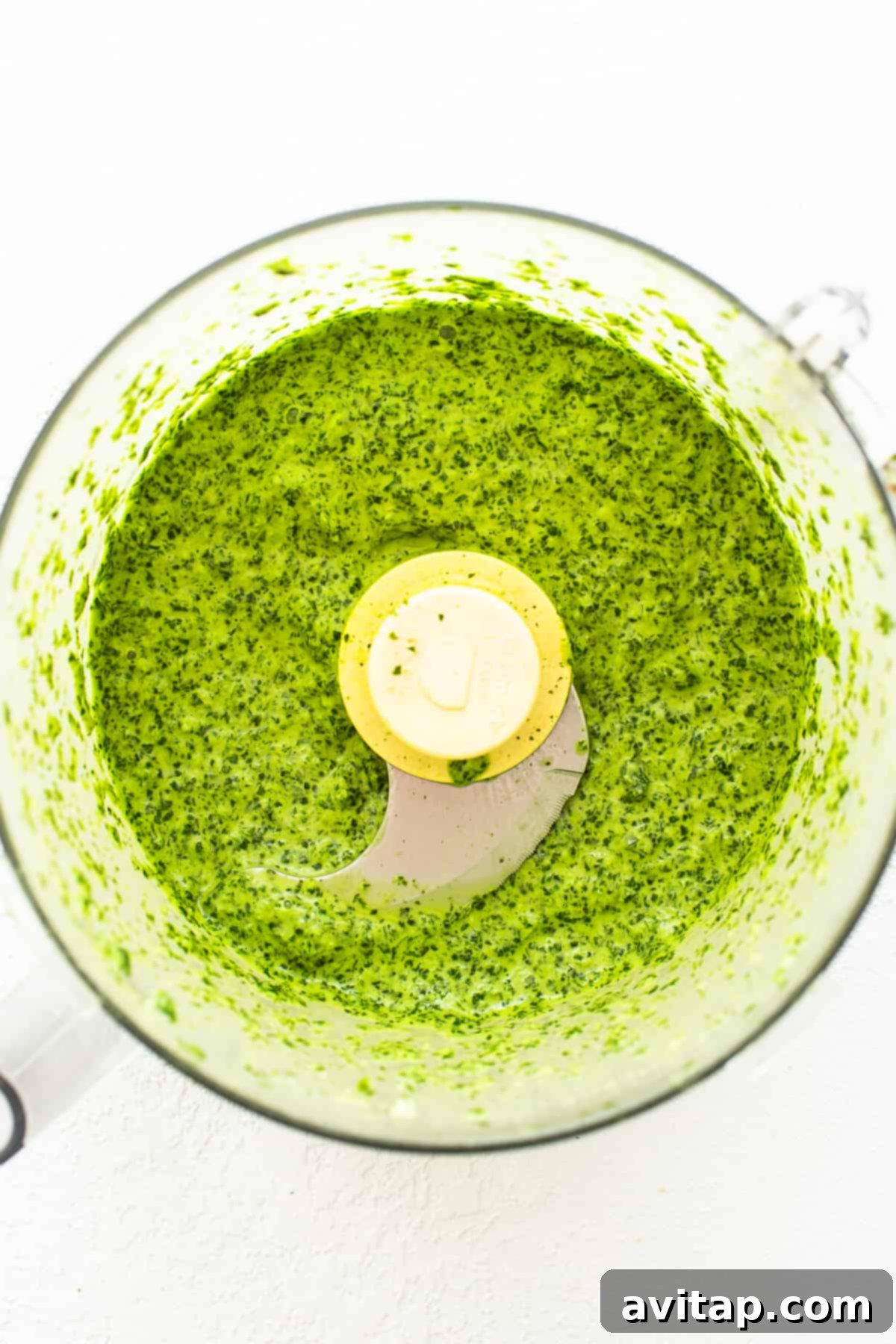 All ingredients for green sauce placed into a food processor, ready for blending.