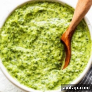 A vibrant green sauce in a bowl, ready for dipping.