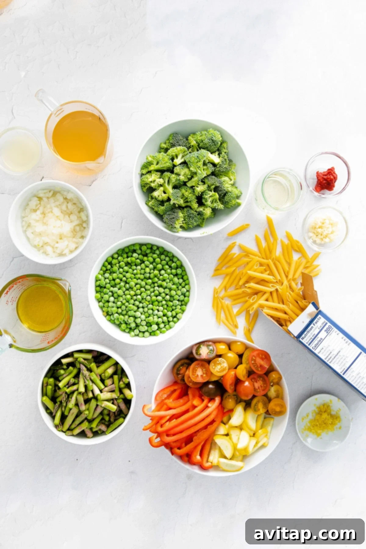 pasta primavera ingredients in bowls, ready to be prepared