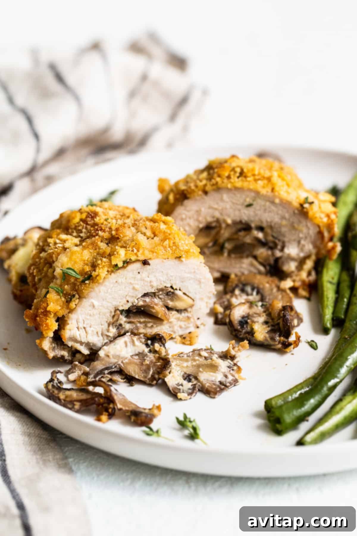 Crunchy, Cheesy Mushroom Stuffed Pork Chops: The Ultimate Weeknight Meal Close-up of golden-brown mushroom stuffed pork chops, showcasing the crunchy exterior.