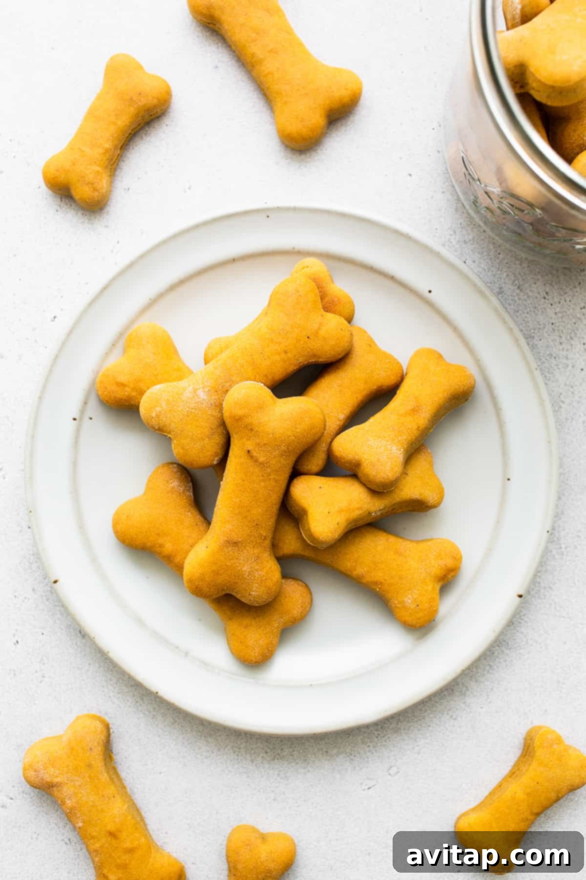 Homemade dog treats neatly arranged on a plate, ready to be enjoyed.