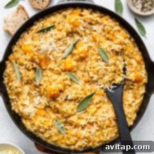 A delicious butternut squash risotto in a skillet with sage and parmesan.